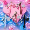 A silver balloon dog-shaped keychain paired with a colorful knot-shaped heart-shaped tag Specification image